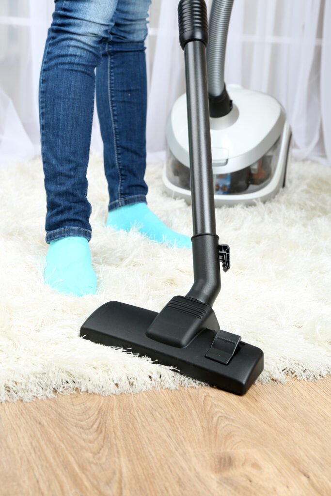 woman with vacuum cleaner room